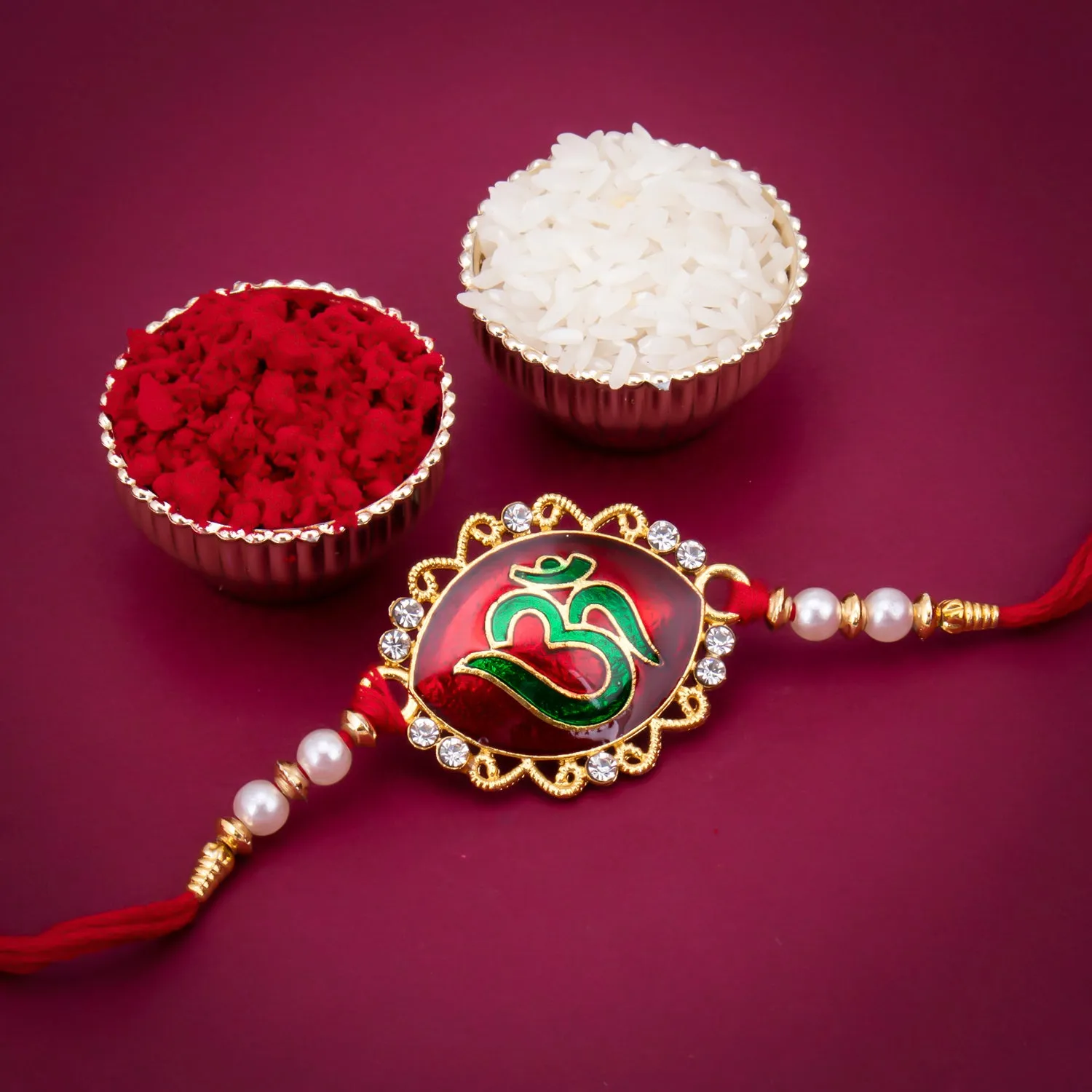 Sukkhi Resplendent Gold Plated Meenakari OM Designed Rakhi with Roli Chawal and Raksha Bandhan Greeting Card For Men